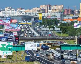 Image of a busy road in Russia with billboards on all sides