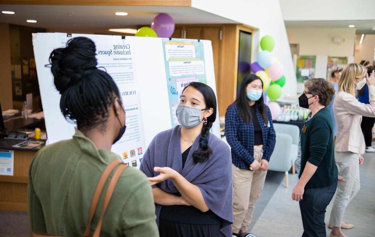 Students attending the Praxis Poster Session 2022