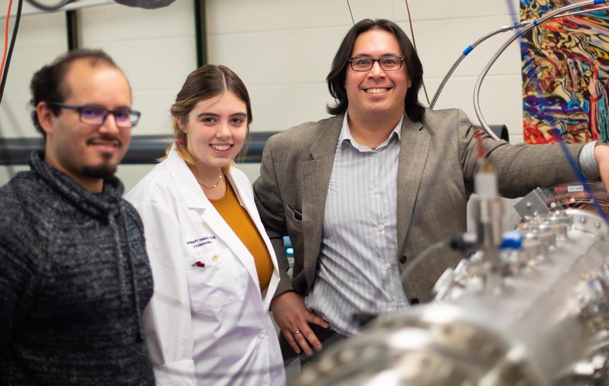 Assistant Professor of Physics David Schaffner (left), Maise Shepard '20, and Ph.D. Candidate Carlos Cartegena