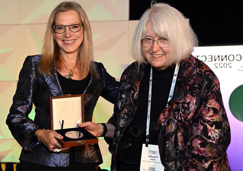 GSA President Barbara Dutrow awards the GSA President’s Medal to Priscilla Grew '62. Photo credit: Geological Society of America, photo by Bill Cronin.