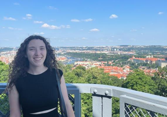 Anna Lowrance standing in front of a view of Prague