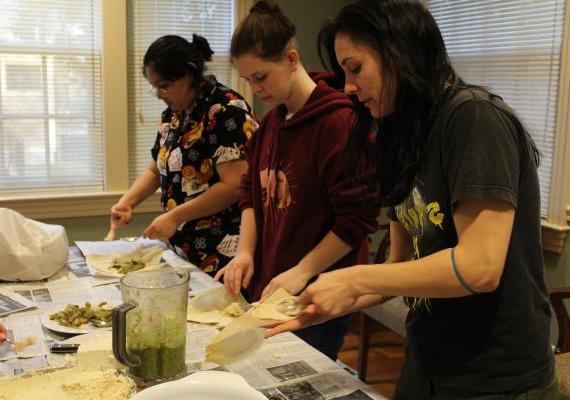Migrations 360° students put together tamales in the SGA kitchen.